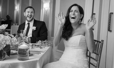 Bride and Groom reacting to the best man's toast.