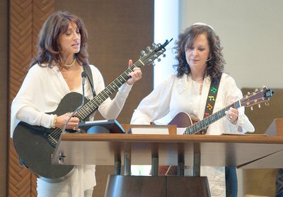 Mom playing Guitar at her son's Mitzvah