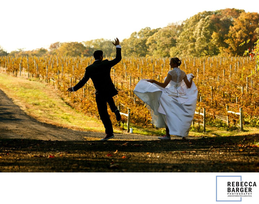 The bride word St. Pucchi and converse as she and her groom ran through the vineyard. 