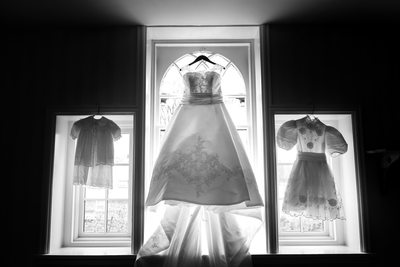 Passage of time in dresses.  Christening gown, wedding gown, confirmation gown.  