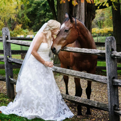 A few horsey kisses outside the barn, on wedding day. 