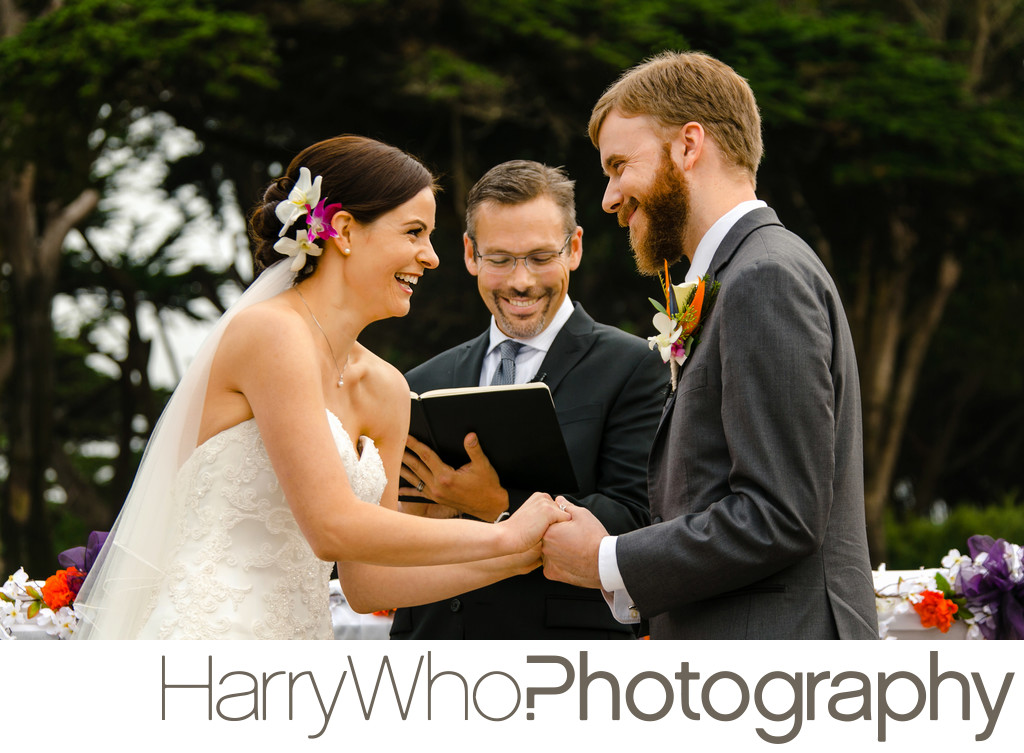 A Wedding Couple laugh during their Wedding Ceremory at SF Zoo