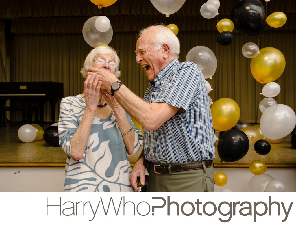 A couple having fun at the husband's retirement party