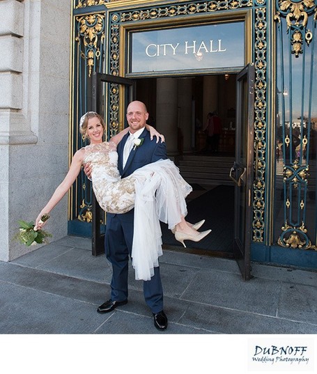 Newlyweds leaving SF City Hall after wedding pictures completed