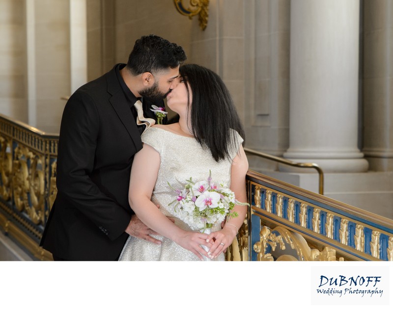 San Francisco city hall railing wedding photo for bride and groom with bouquet