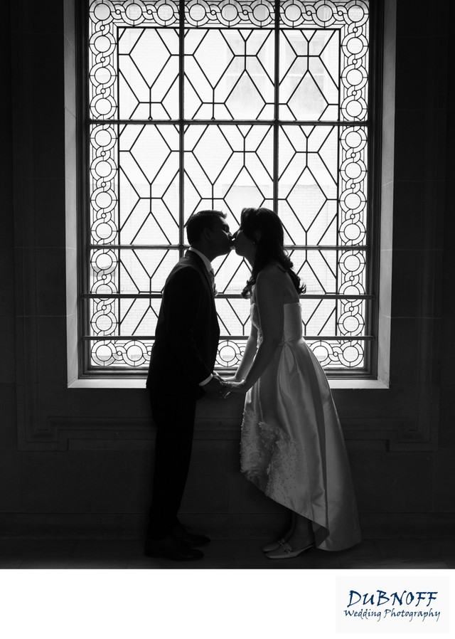 3rd Floor North Window wedding photography kiss at city hall
