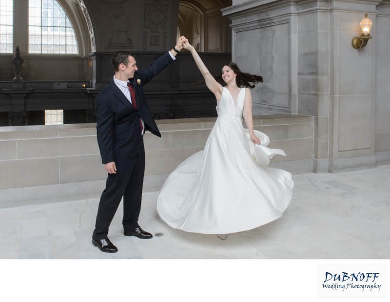 Dance twirl on the 4th floor of San Francisco city hall - wedding photography