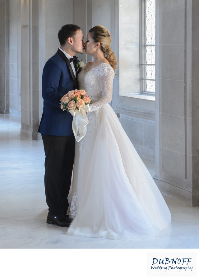 Bride and groom kissing - San Francisco city hall wedding photography