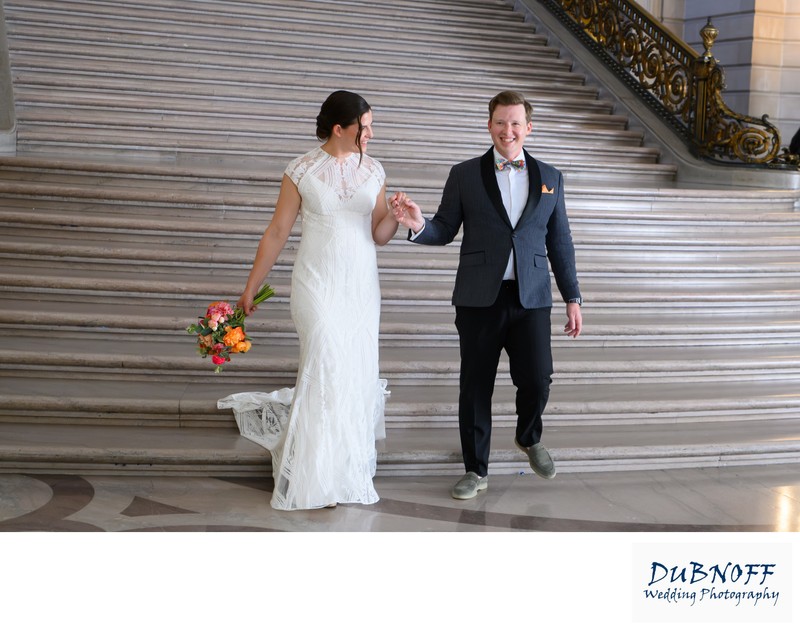 SF City Hall Bride and Groom walk down the Grand Staircase