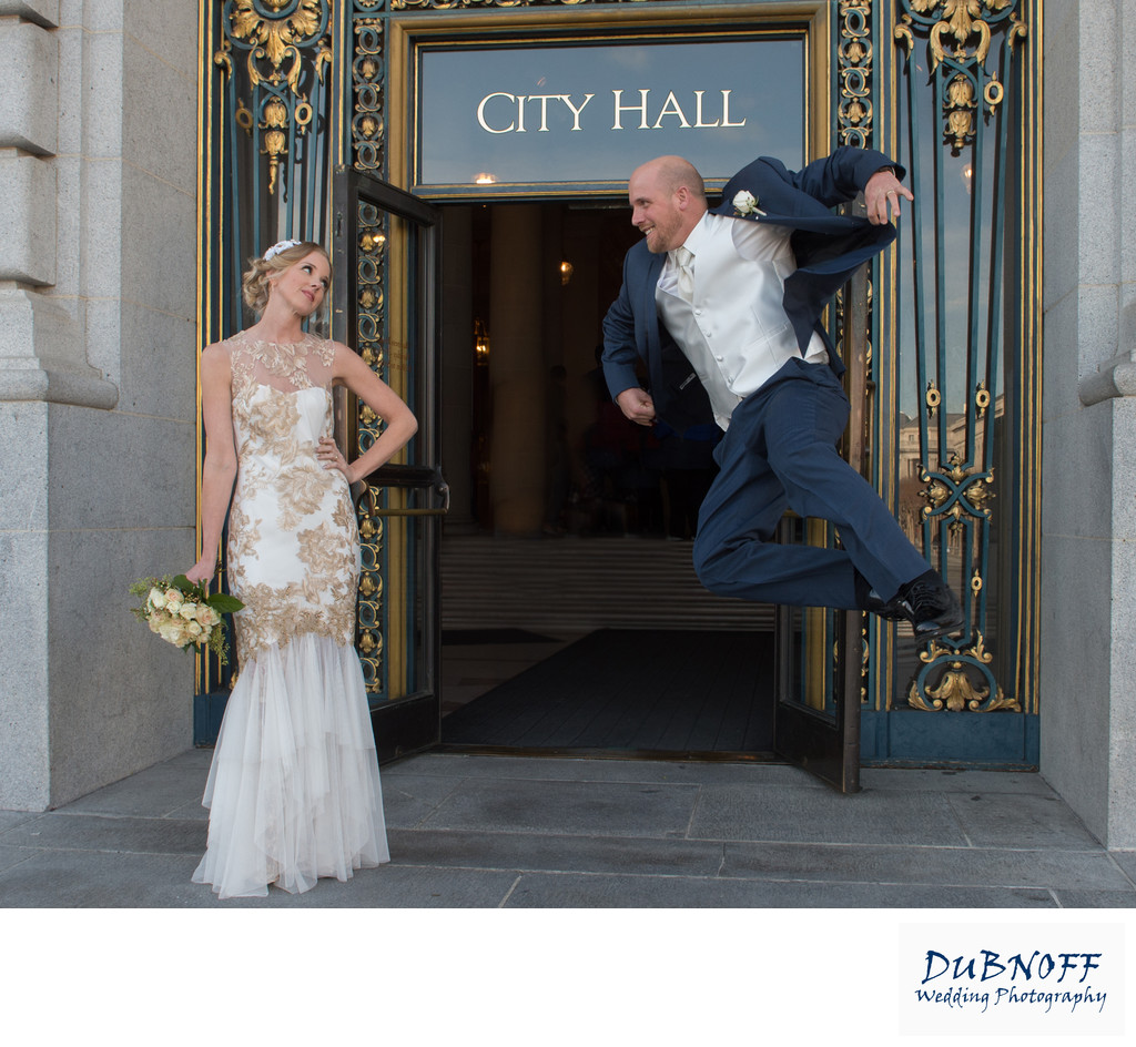 groom jumps in san francisco in front of City Hall