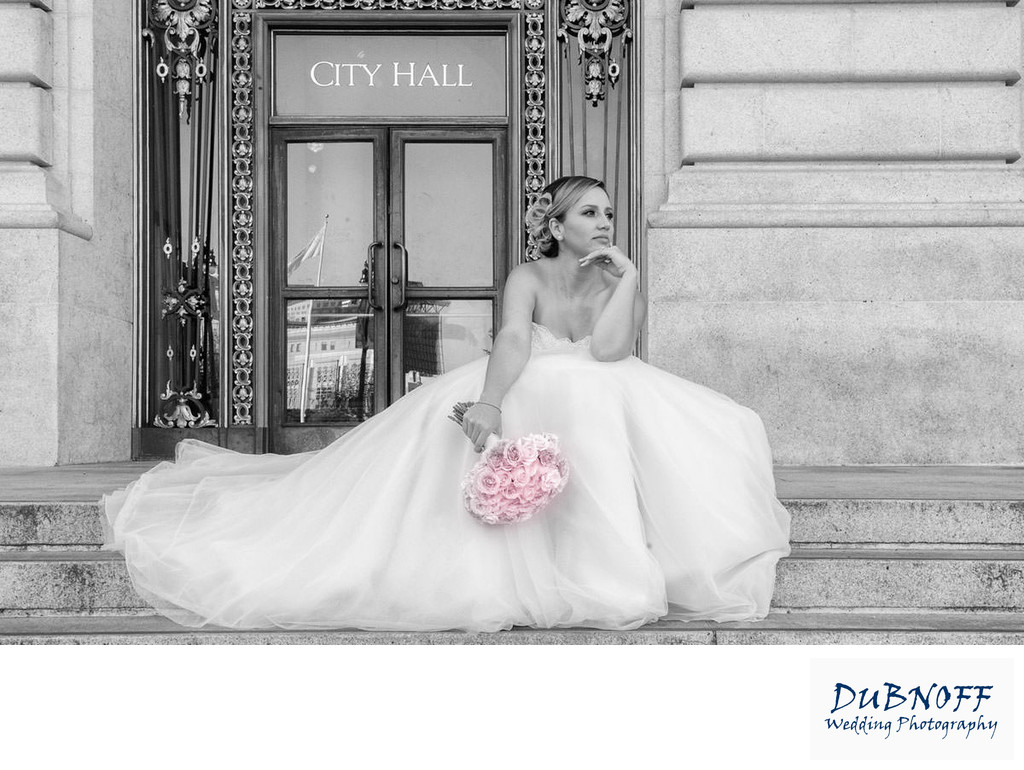 Beautiful bride waiting on the front steps of SF City Hall
