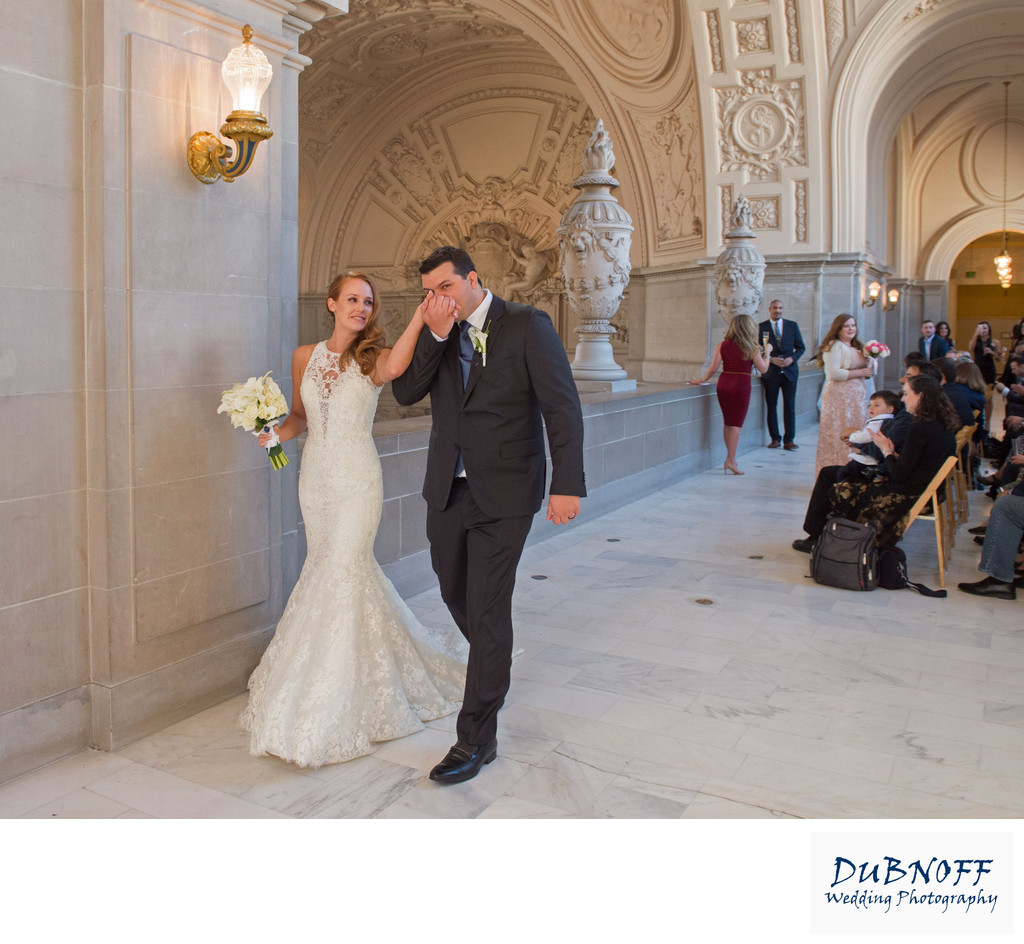 SF City Hall ceremony kiss, a candid wedding photography example