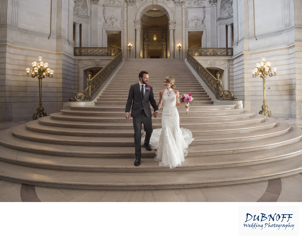 Bride and Groom walking the Grand Staircase at City Hall