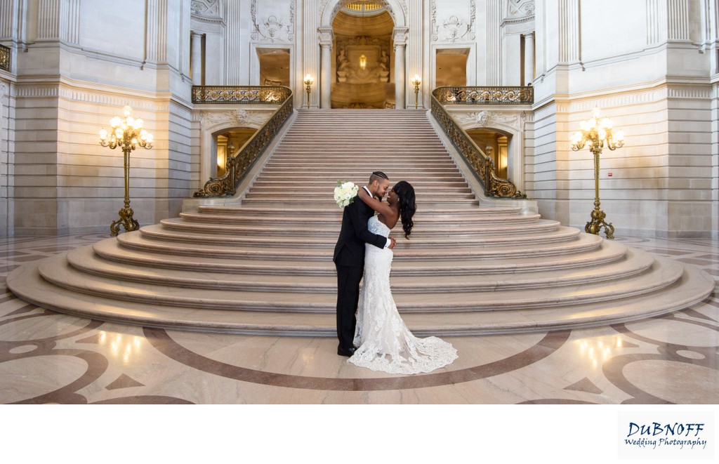 Elegant wedding photo in front of the Grand Staircase at City Hall