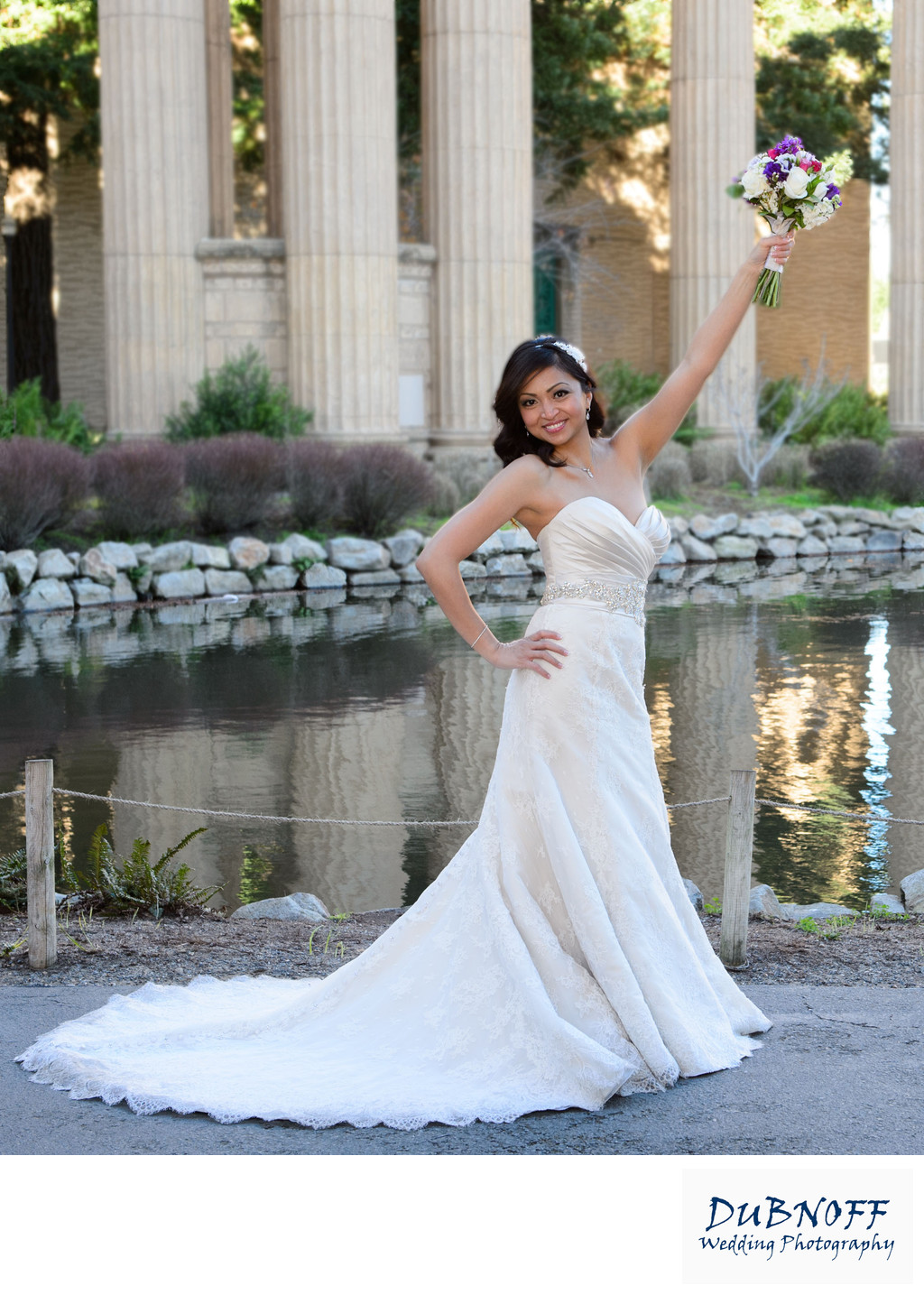 fun bride at palace of fine arts with flower bouquet