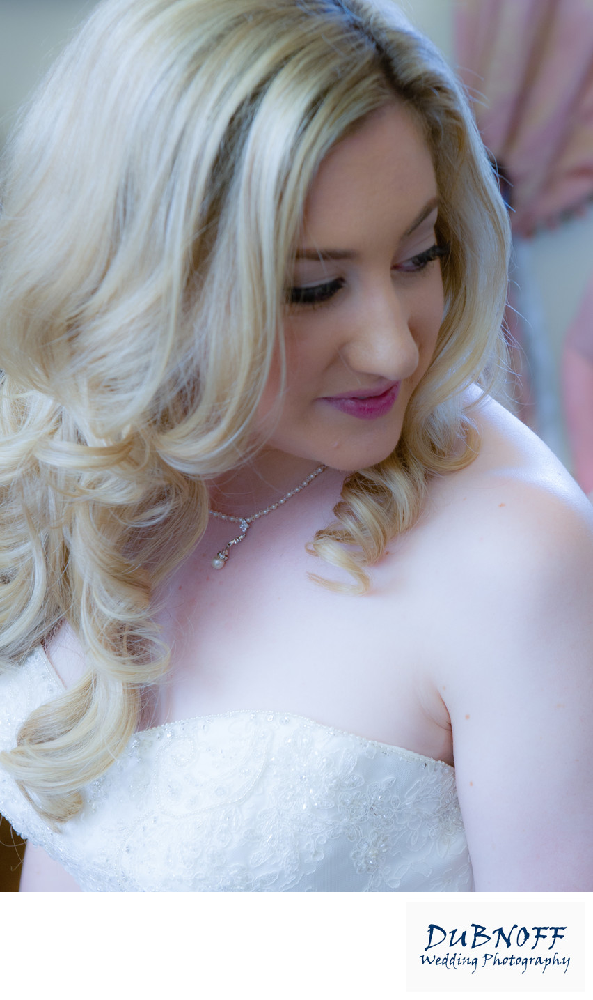 bride looking over shoulder during portrait photography