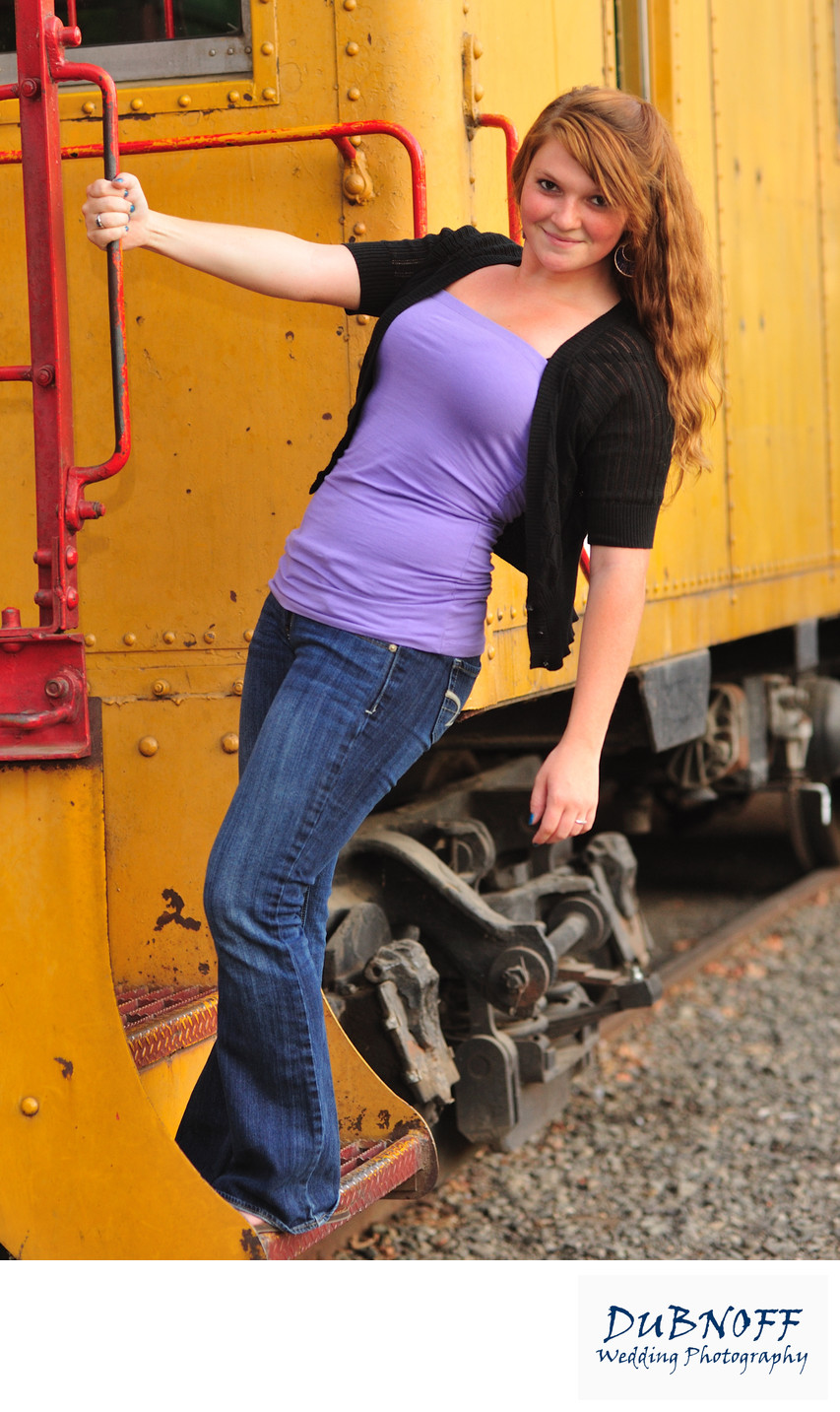 Portrait of High School Girl hanging off a train in Sacramento