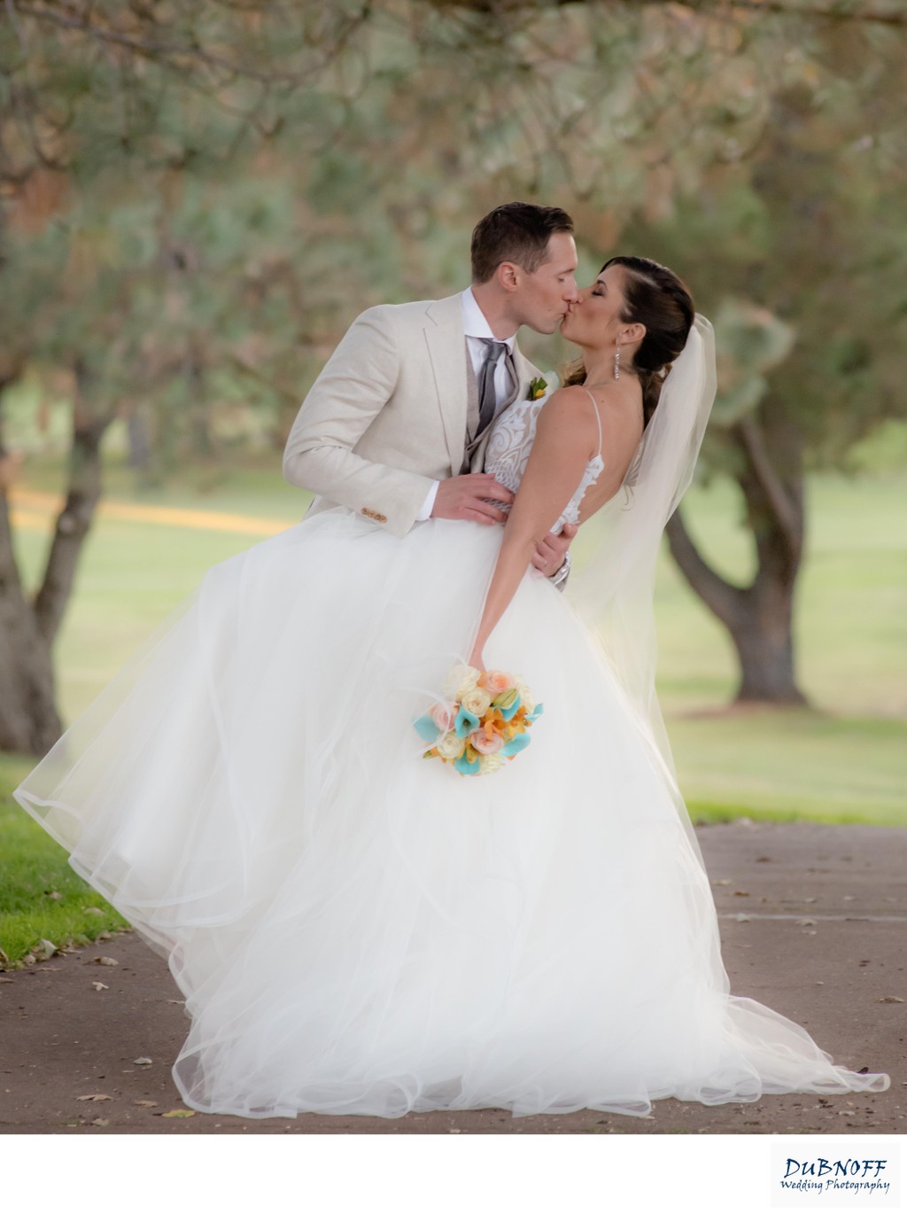 Bride kissing Groom on Bay Area Golf Course in San Francisco