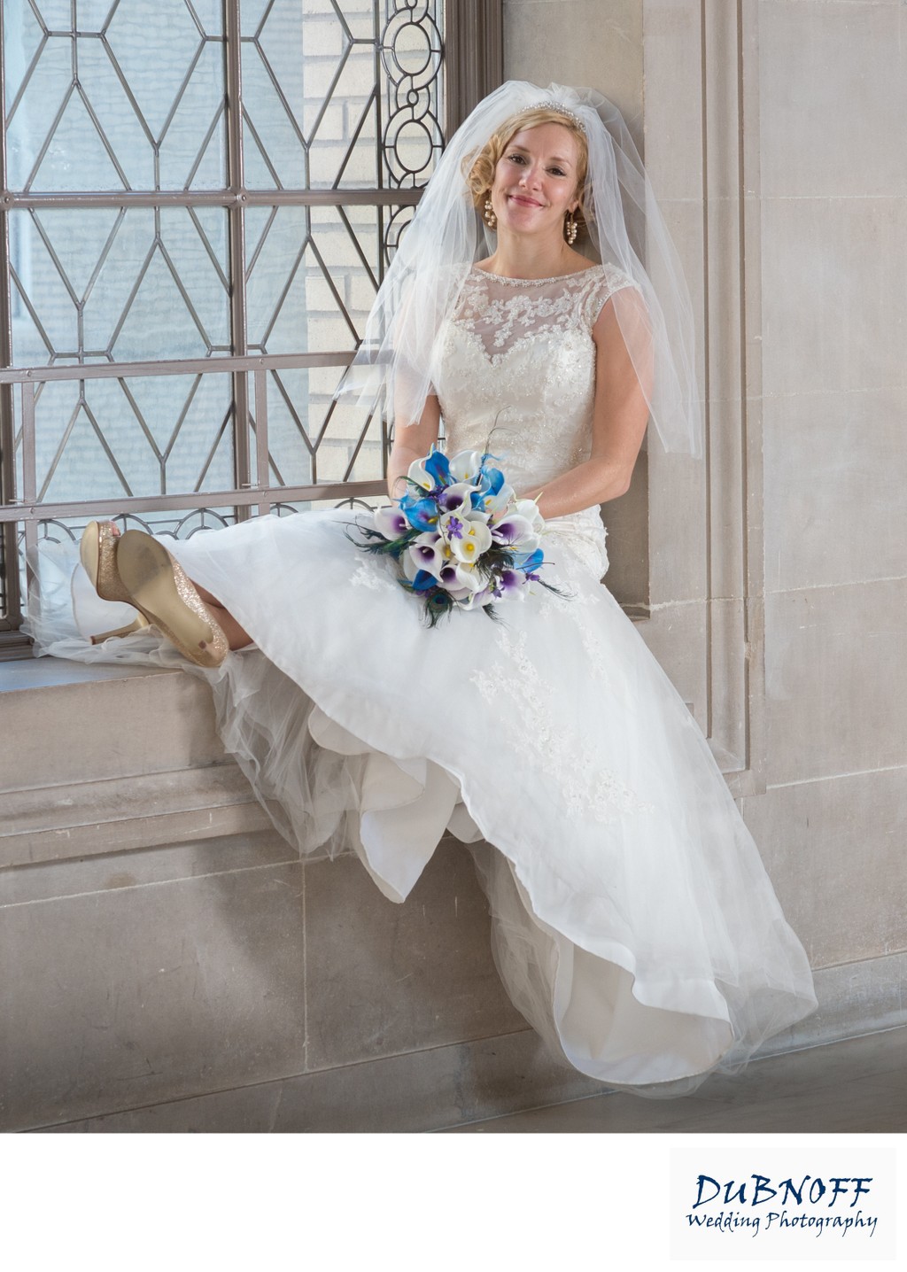 SF City Hall bride relaxing on window during photo shoot