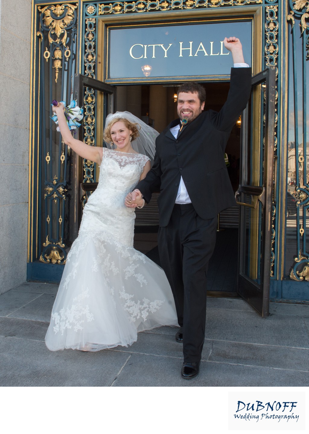 Bride and groom happily exiting San Francisco city hall after wedding