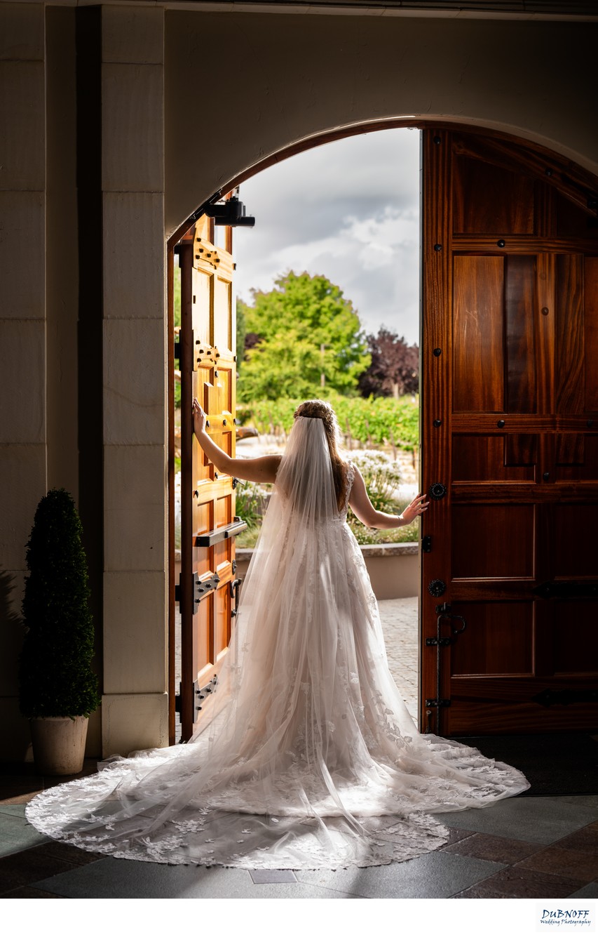 Casa Real Bride looking out through the cellar doors - wedding photography
