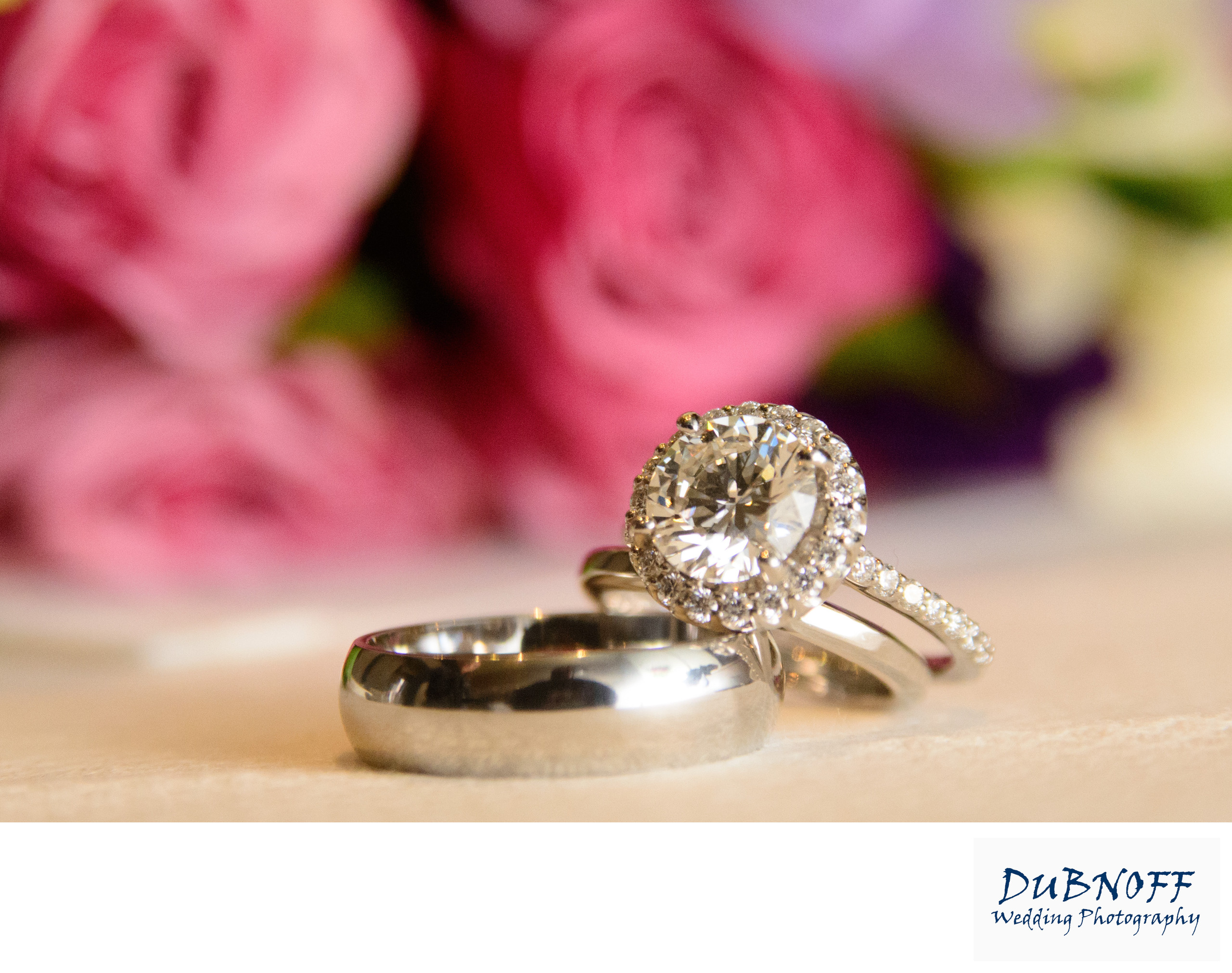 rings and flowers at wedding close up detail image.