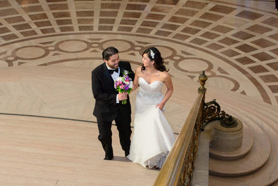 bride and groom work there way up the Grand Staircase