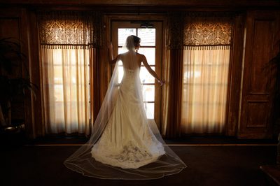 Wedding Photography image with bride under window