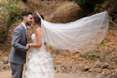 bride and groom kiss at Wildwood Acres 