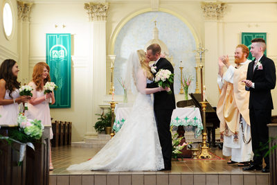 ceremony congratulations with a kiss at the area church