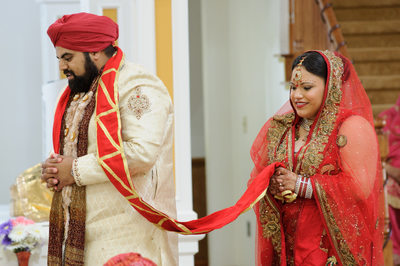 Sikh Wedding Ceremony bride and groom walking around the table