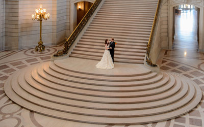 grand staircase sf city hall with Bride and Groom