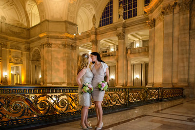 brides kissing at their san francisco city hall wedding