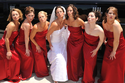 Walnut Creek Bride Posing with her Attendants in Red Dresses