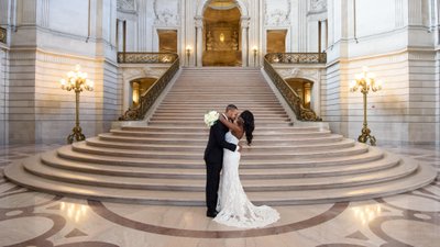Elegant wedding photo in front of the Grand Staircase at City Hall