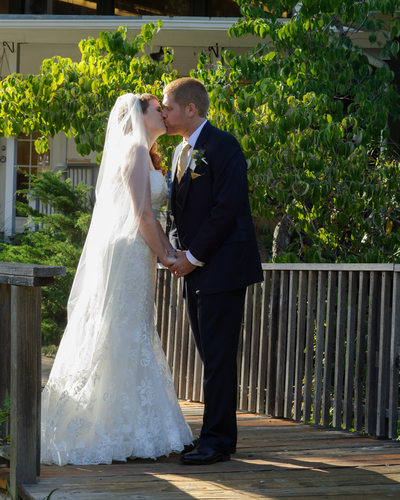 ceremony kiss in Marin County with bride and groom