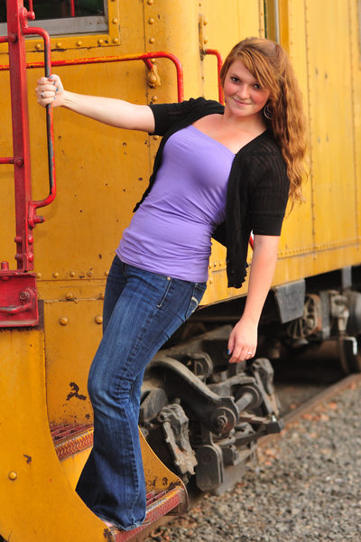 Portrait of High School Girl hanging off a train in Sacramento