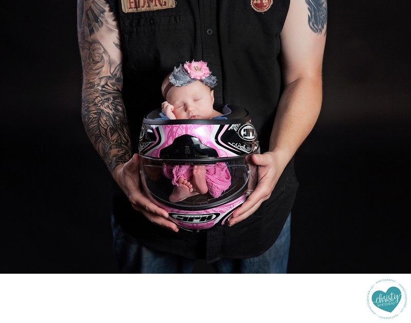 Newborn in momma's motorcycle helmet NEWBORNS