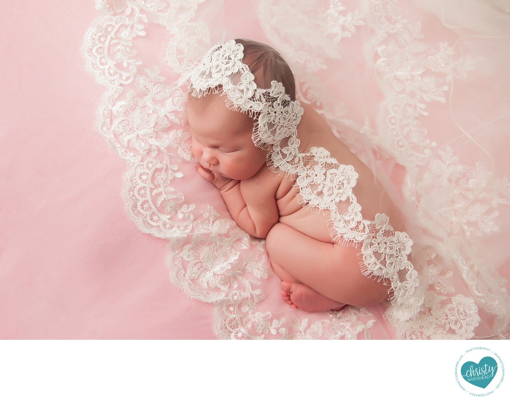 Newborn photo shoot with wedding veil