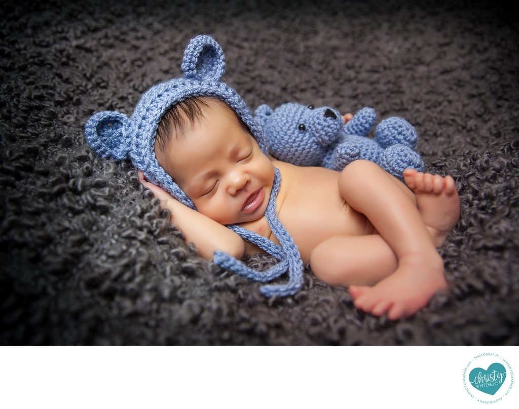 Sweet newborn with blue bear