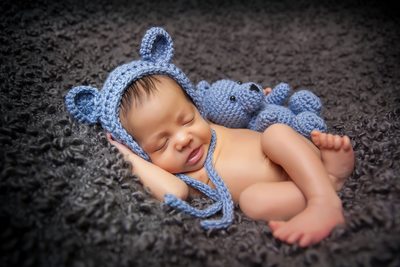 Sweet newborn with blue bear