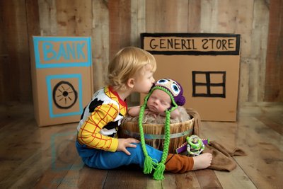 Newborn and sibling Toy Story Themed photo shoot
