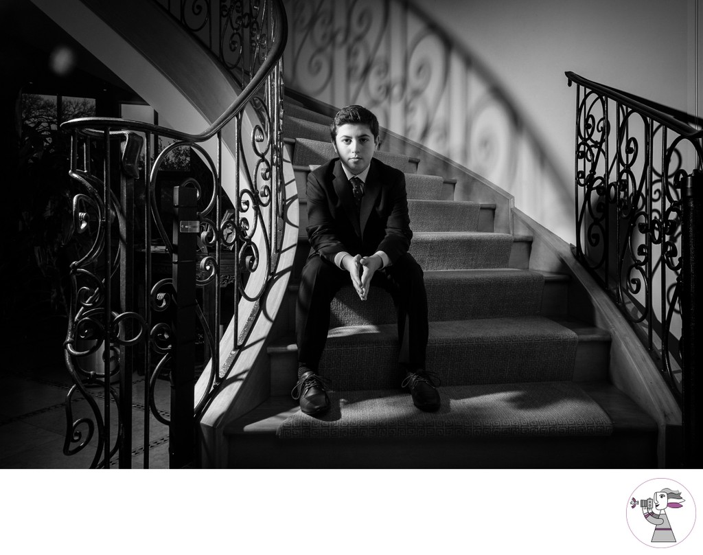 Senior portrait of a young man on a stair