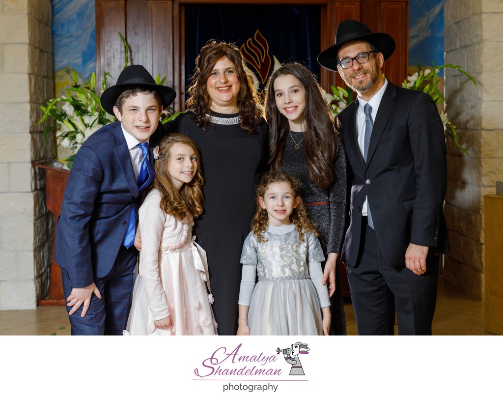 Rabbi Moskovitz with Family in a Synagogue