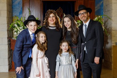 Rabbi Moskovitz with Family in a Synagogue