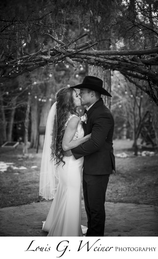 Off the Wall: Cowboy groom kisses his bride before the mass wedding in the  Stockyards