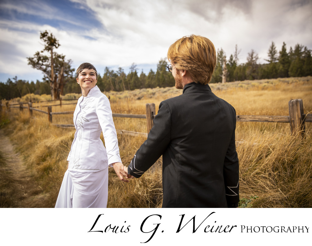 Bride leading her groom at Wedding at Gold Mountain Manor