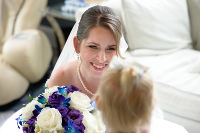 Flower girl admires the bride