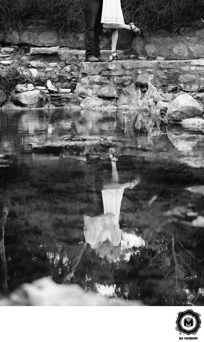 Engaged Couple Kissing in Water's Reflection