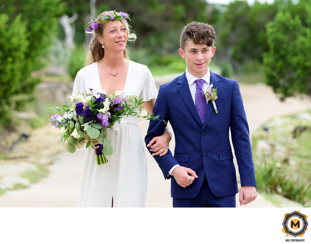 Chapel Dulcinea | Bride Walking Down Path with Son